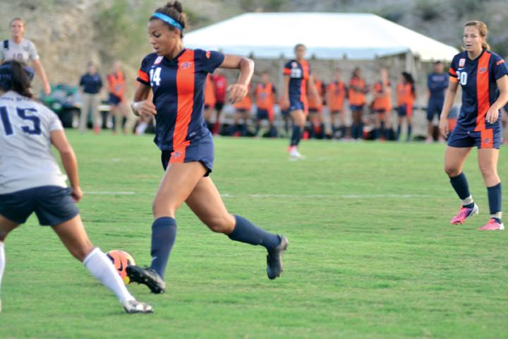 junior Aleah Davis driving the ball against Utah State