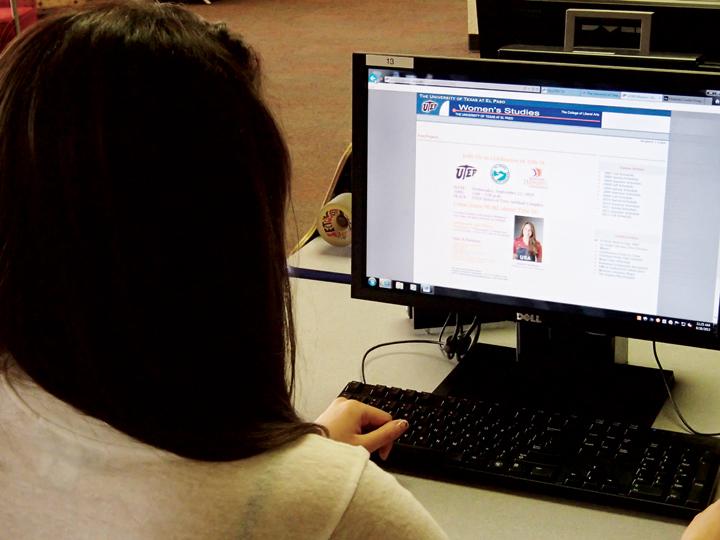 Senior electrical engineering major Edith Mejia glances through the Women’s Studies website although the degree is not yet available to students. 
