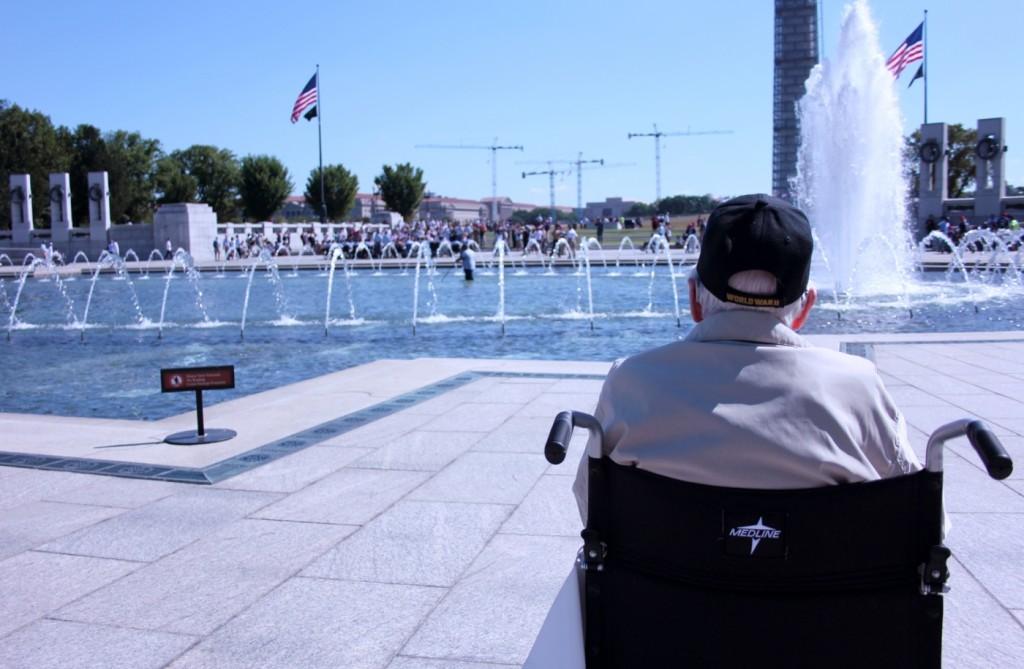 A World War II veteran takes a moment to admire the National World War II Memorial. He was one of more than 300 veterans who received a free trip to Washington over the weekend.