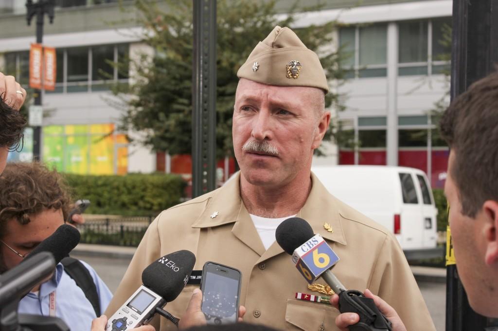 Navy Cmdr. Tim Jirus says that a man standing next to him was shot and killed as both tried to escape from the shooter at the Washington Navy Yard on Monday. SHFWire photo by Nick Prete