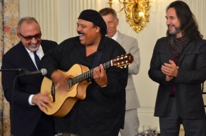 Latin artists at the White House finish the morning’s workshop by singing “La Bamba” Monday at the White House. Emilio Estefan, left, and Marco Antonio Solís, right, accompany the guitarist in song. 