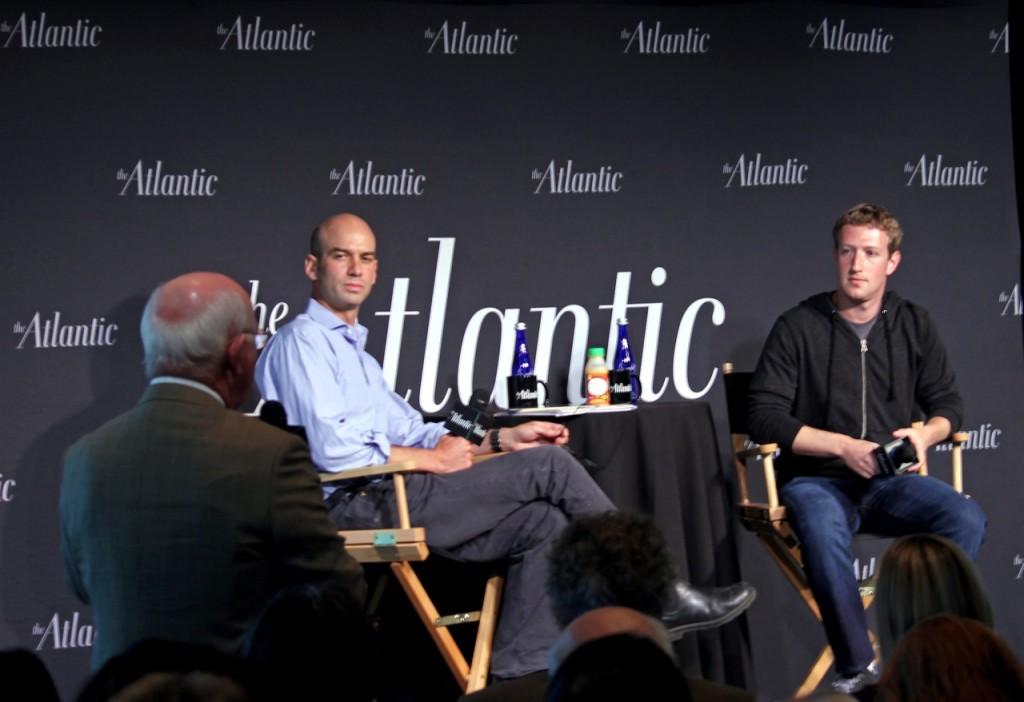 Journalist Terence Smith, left, asks Mark Zuckerberg, far right, if Facebook would ever go into the news business, become a news aggregator-type service or a forum at Wednesday’s event. Zuckerberg said Facebook would probably not produce news content. James Bennet, center, editor of Atlantic magazine, looks on.
