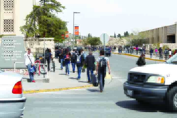 Students evacuate campus on March 26 after a bomb threat was called in.