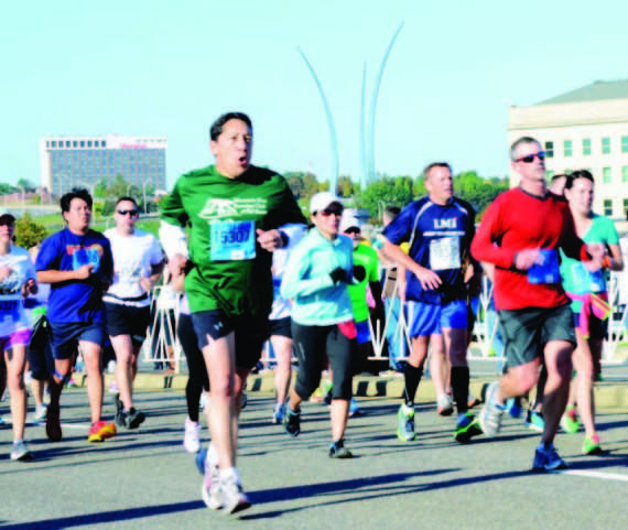 The Army Ten Miler runners make their way to the finish line Sunday morning. Nearly 35,000 runners were registered to run the annual race.