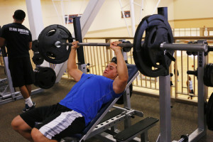 Frank Ayala, junior criminal justice major, gets some reps on the bench press. 