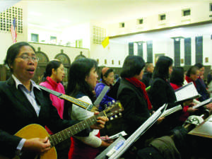  The Blessed Sacrament Choir sings at the service. The church held an evening prayer service for people affected by Typhoon Haiyan. 