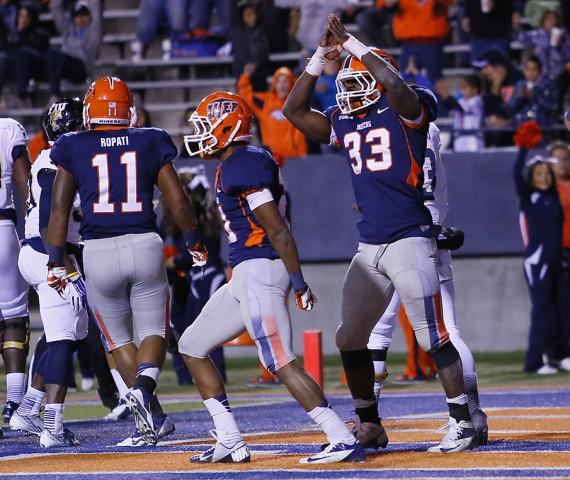 Senior linebacker Horace Miller (right) celebrates after getting a safety against Florida International on Nov. 16