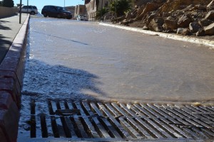 Water rushes down Kirby Avenue on Dec. 17 at around 2 p.m.