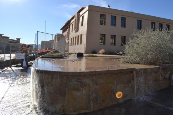 Water+pours+over+the+fence+down+the+street+from+the+Psychology+Building.