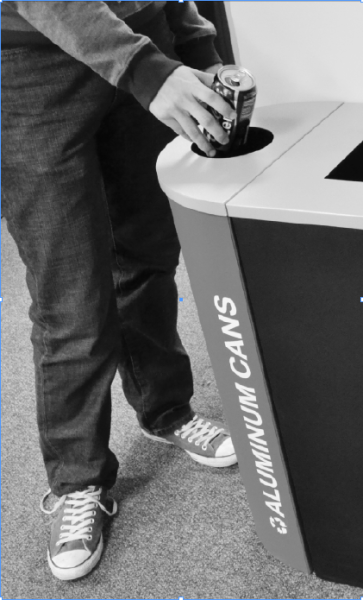 A student uses the new recycling bins placed in Union Building East.