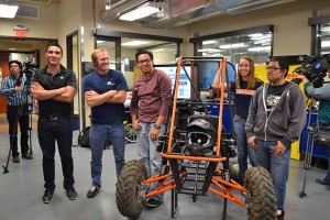 Students pose with a buggy that serves as an example for what may be entered into the competition.