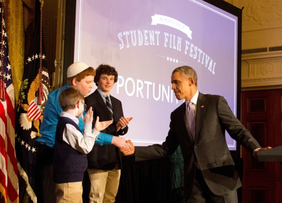 David Posnack Jewish Day School seventh-grader Kyle Weintraub, 12, of Davie, Fla., shakes hands with President Barack Obama at the first White House Film Festival. Kyle, who uses a robot to attend school from a hospital in Pennsylvania, was the subject of a student film recognized by Obama.