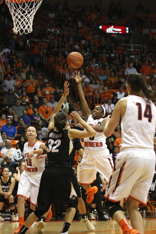 Kelli Willingham attempts a layup up over Buffs defender Arielle Roberson.