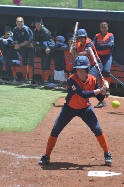 Junior oufielder Ashley Eldridge observes the ball pass on its way to the plate.