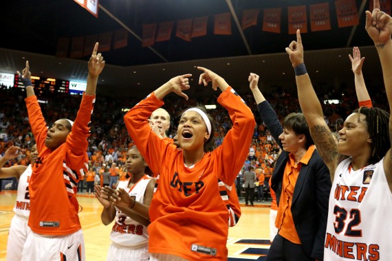 Sparkle Taylor (left), Cameasha Turner (middle) and Chrishauna Parker (right) celebrate 66-63 victory over South Dakota State on April 2.