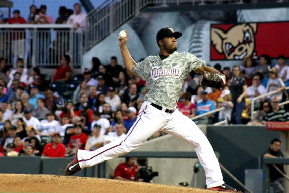 Starting pitcher Keyvius Sampson throws a fast ball against Isotopes during the fifth inning.  