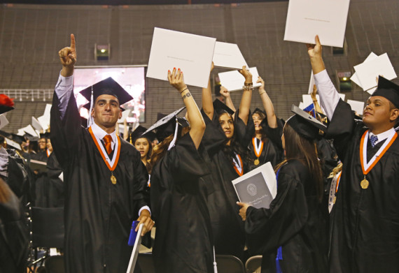 Over+2%2C800+students+from+the+class+of+2014+receive+their+diploma+in+the+centennial+commencement.