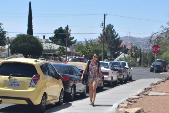 Student walks to campus from the Sunset Heights neighborhood.