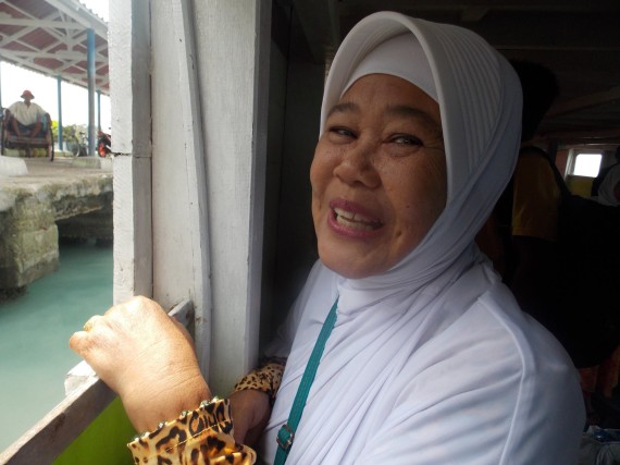 A woman waits to leave the boat for Harapan Island.