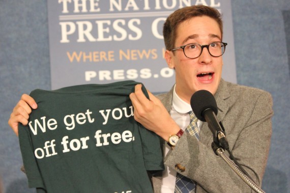 Erin Furleigh, a junior at Iowa State University, and Paul Gerlich, a sophomore, show two T-shirt designs for their school’s chapter of the National Organization for the Reform of Marijuana Laws during a news conference Tuesday. The university withdrew its approval of Furleigh’s shirt after initially approving it. She and Gerlich have sued the university. 