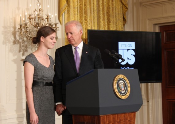 Vice President Joe Biden holds hands with Lilly Jay after she told the audience her story of being sexually assaulted and how she overcame it to become a stronger student and woman. 