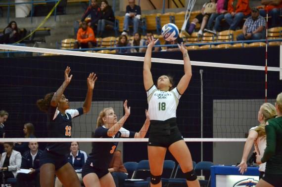 Freshman Krystal Ejesieme (left) and Dalainee Perry (right) prepare to block a CSU kill attempt