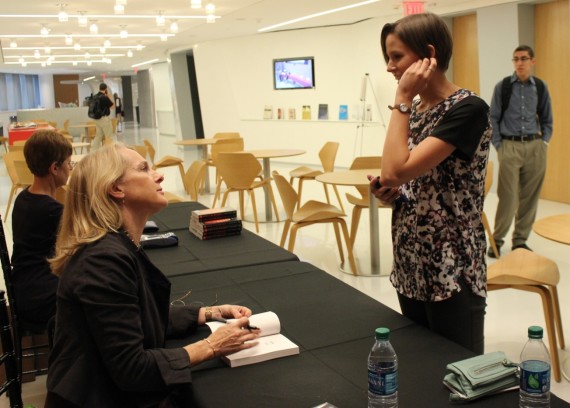 Piper Kerman signs copies of her book, “Orange Is the New Black” about the mistreatment of women in prisons after she was given an award Wednesday in Washington for her work on prison reform issues. 