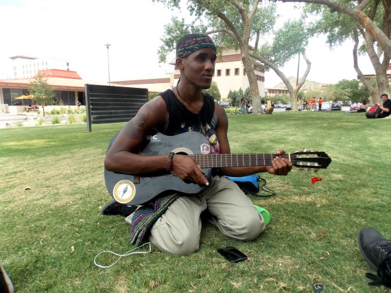 Sophomore history major Tajei Lee Roy Harper plays guitar in front of the Library.  
