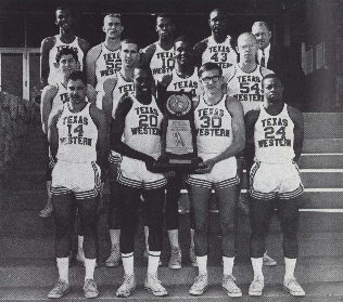 The complete 66 team posing with the trophy outside of Memorial Gym.