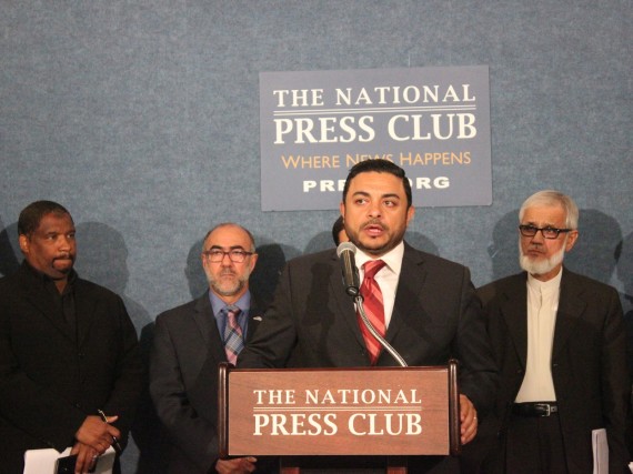 Ahmed Bedier, president of United Voices for America, center, urges the Muslim community to discourage their youth from joining the Islamic State group. Masjid Muhammad Assistant Imam Ben Abdul-Haqq, left, Secretary General for the U.S. Council of Muslim Organizations Oussama Jamal and Fiqh Council of North America Chairman Muzzammil H. Siddiqi, right, look on.
