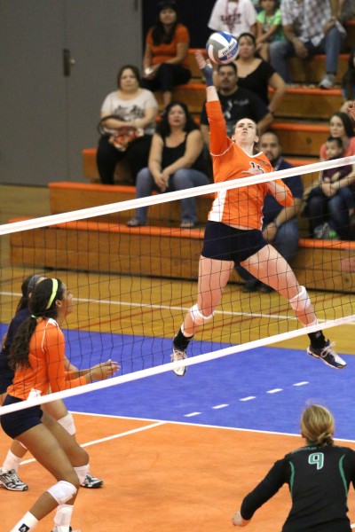 Senior outside hitter Jacqueline Cason attempts an attack against North Texas.