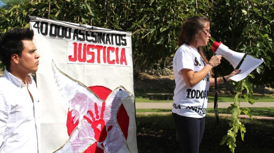 Sharon Murillo, graduate philosophy major, speaks at Wednesdays protest.