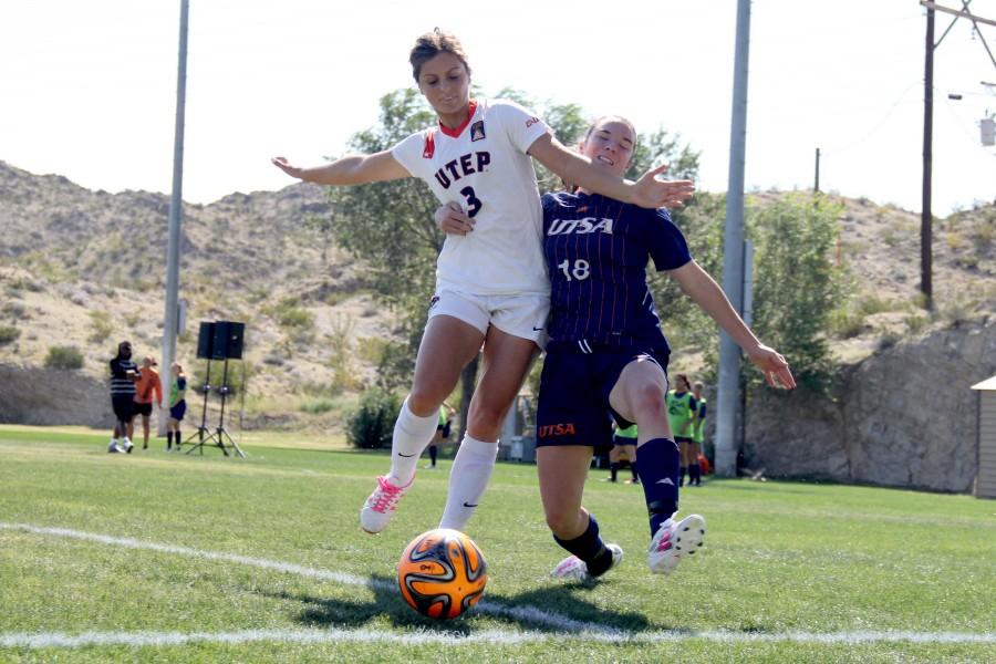 Senior center back Hannah Asuchak attempts to steal the ball from a UTSA midfielder.