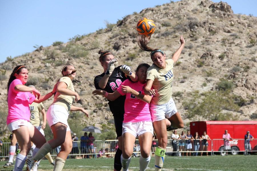 UTEP goalkeeper Sarah Dilling attempting a save.