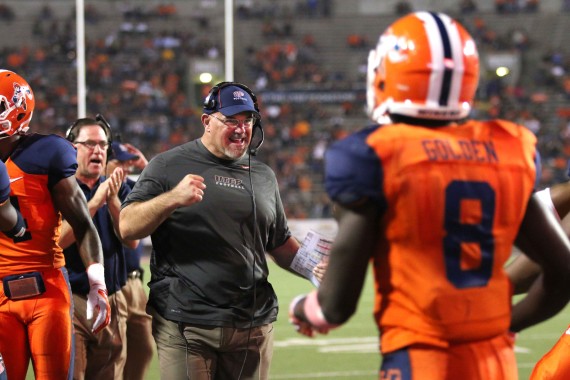 Coach Sean Kugler congratulates his offense after another touchdown. 