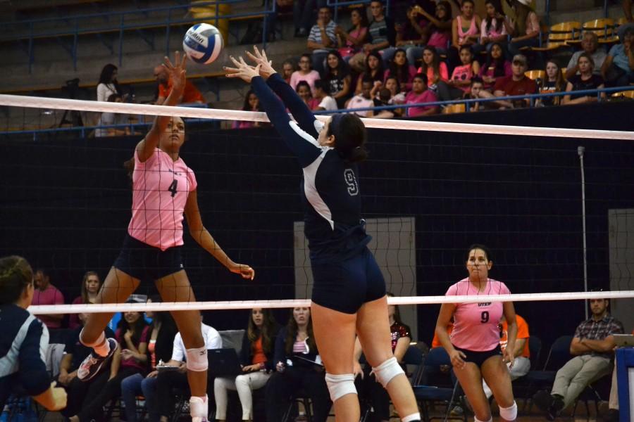 Sophomore middle blocker Dominique Millette attempts an attack on the Rice defense
