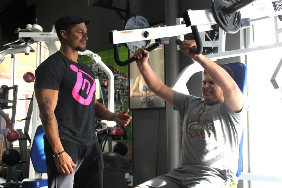 Shane Martinez trains a client at New You Gym.