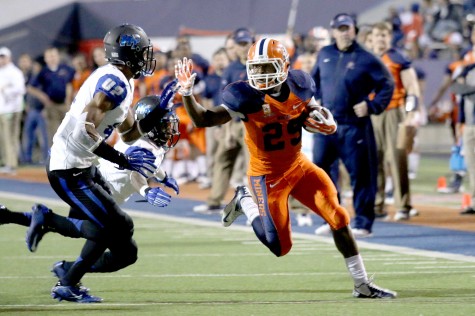 Sophomore running back Aaron Jones stiff arms Middle Tennessee into the endzone.  