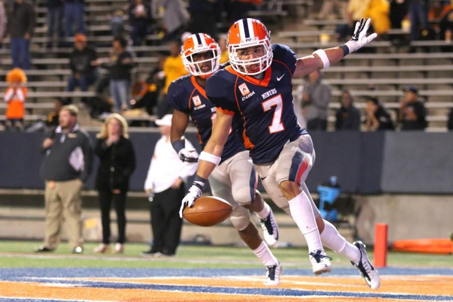 Senior defensive back Nick Gathrite celebrates in the end zone after celebrating a fumble recovery touchdown.