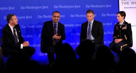 Starbucks CEO Howard Schultz, left; Rajiv Chandrasekaran of the Washington Post, Army vet and charter school official David Oclander, and Army Lt. Col. Kellie McCoy speak about job opportunities for veterans and how Veterans Day should raise awareness in the community.