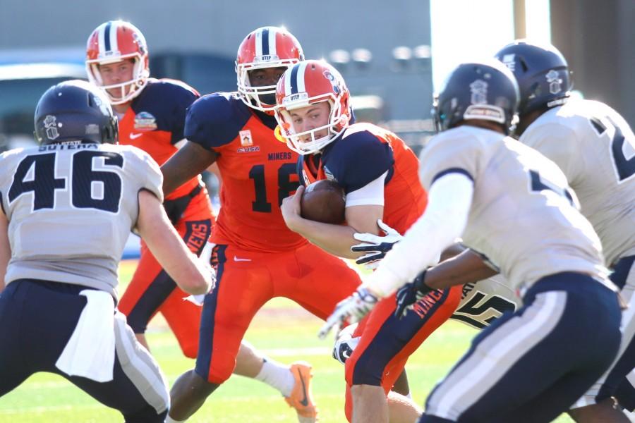 Sophomore place holder Mike Ruggles tries to run for a first down after a botched field goal attempt.