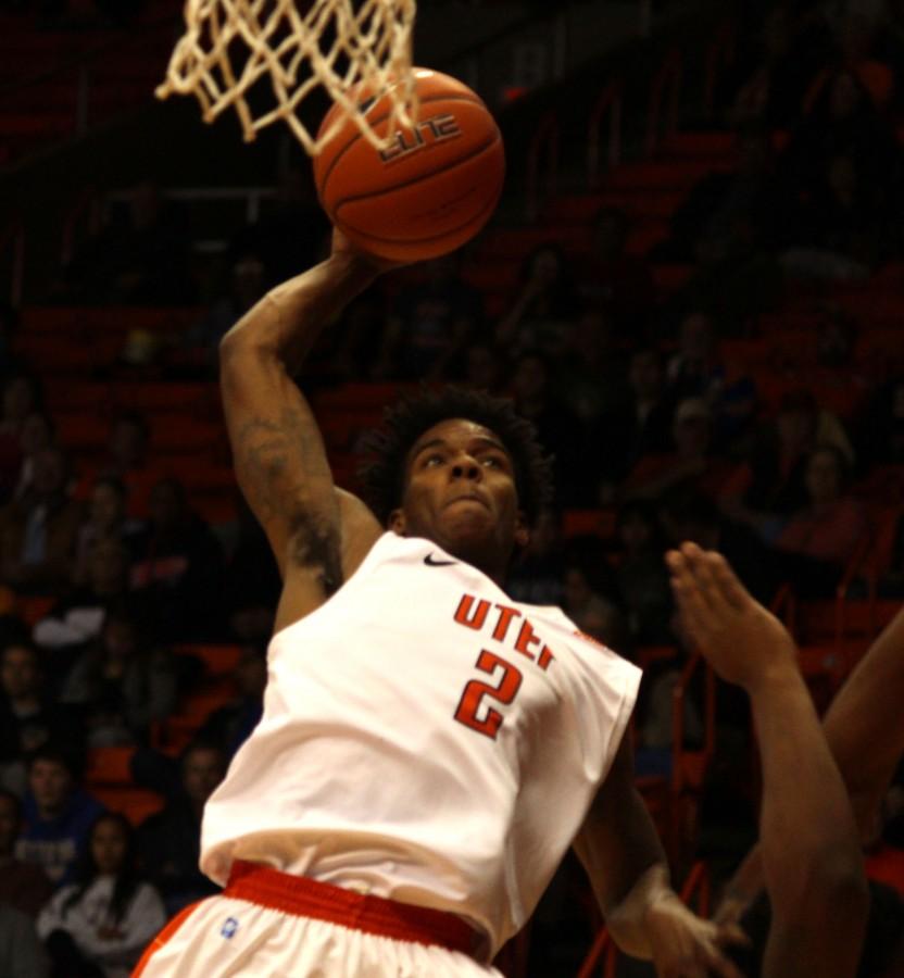 Omega Harris attempts a dunk. 