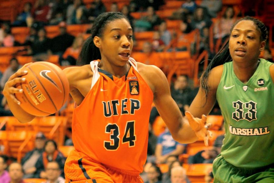 UTEP Forward Lawna Kennedy drives to the basket against a Marshall player. 