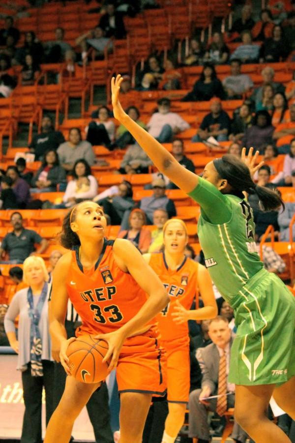 UTEP+Forward+Daeshianna+McCants+attempts+to+evade+a+player+for+the+basket.+