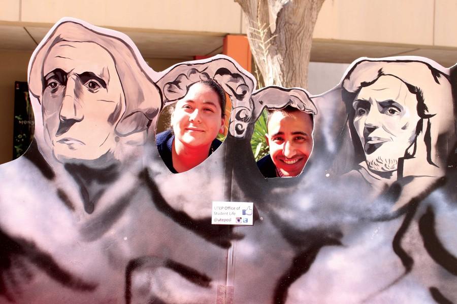 UTEP students Genova Fuentes (Left) and David Ramos (right) pose in the Mt. Rushmore poster as Presidents. 