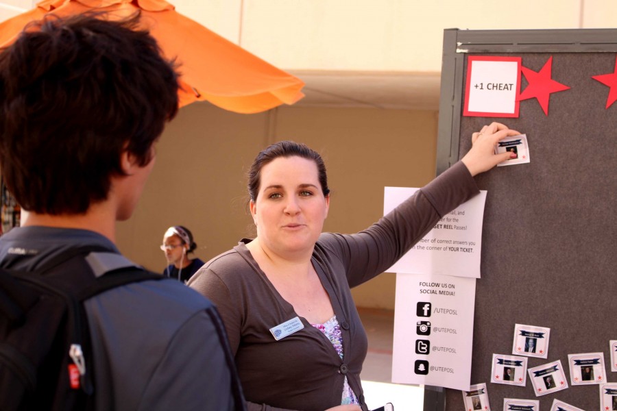 Lindsay Adams teaches a student how to play the Presidents day game. 