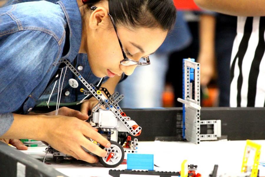 A FIRST Championship competitor readies her robotic apparatus. 