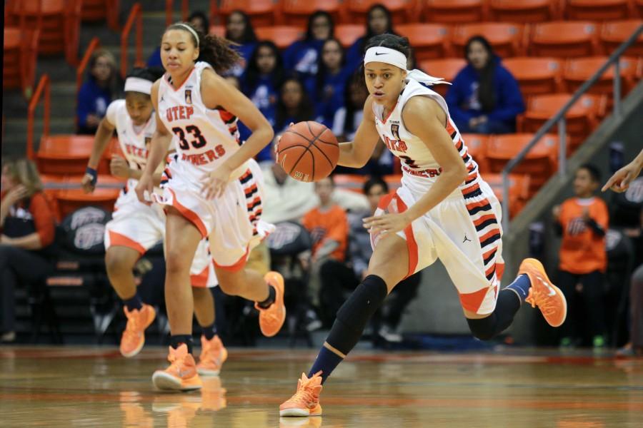 Junior guard Cameasha Turner runs ball across court in the first half. 