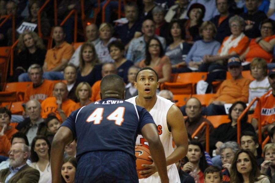 CJ Cooper looks to the hoop as hes being defended. 