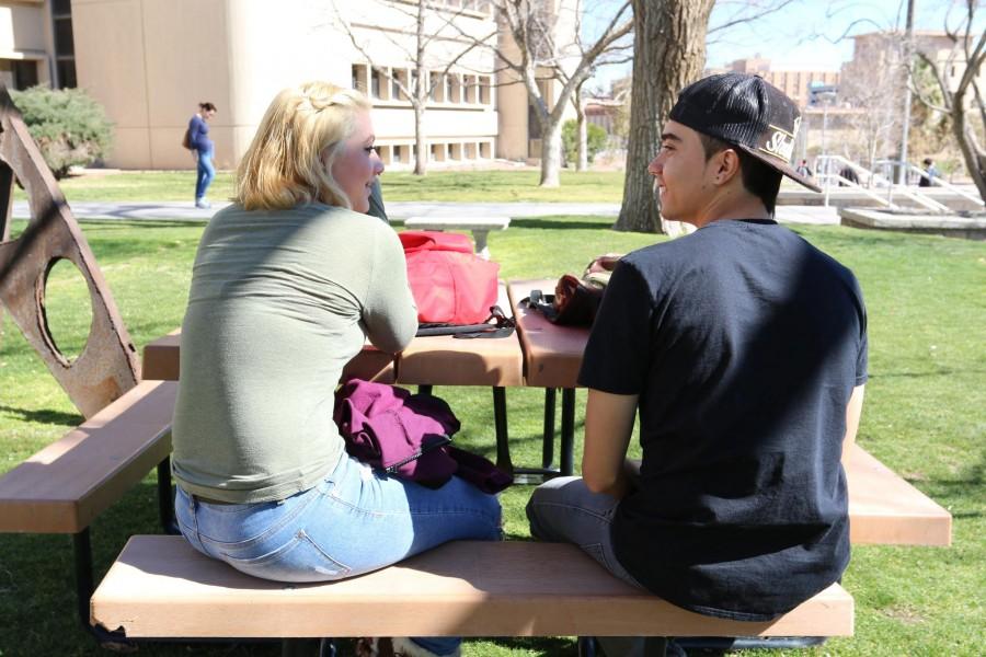 Two students talk in between classes. They are not affiliated with the story. 